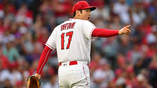 Jul 28, 2022; Anaheim, California, USA; Los Angeles Angels starting pitcher Shohei Ohtani (17) reacts to the double play thrown against the Texas Rangers to end the top of the third inning at Angel Stadium. Mandatory Credit: Gary A. Vasquez-USA TODAY Sports